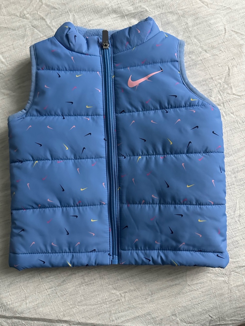 Nike Kids Light Blue Puffer Vest with Pink Swoosh and Multicolor Accents